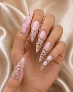 Blush Papillon press-on nails worn on hand — pink butterfly and opal design