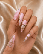 Blush Papillon press-on nails on hand, close-up