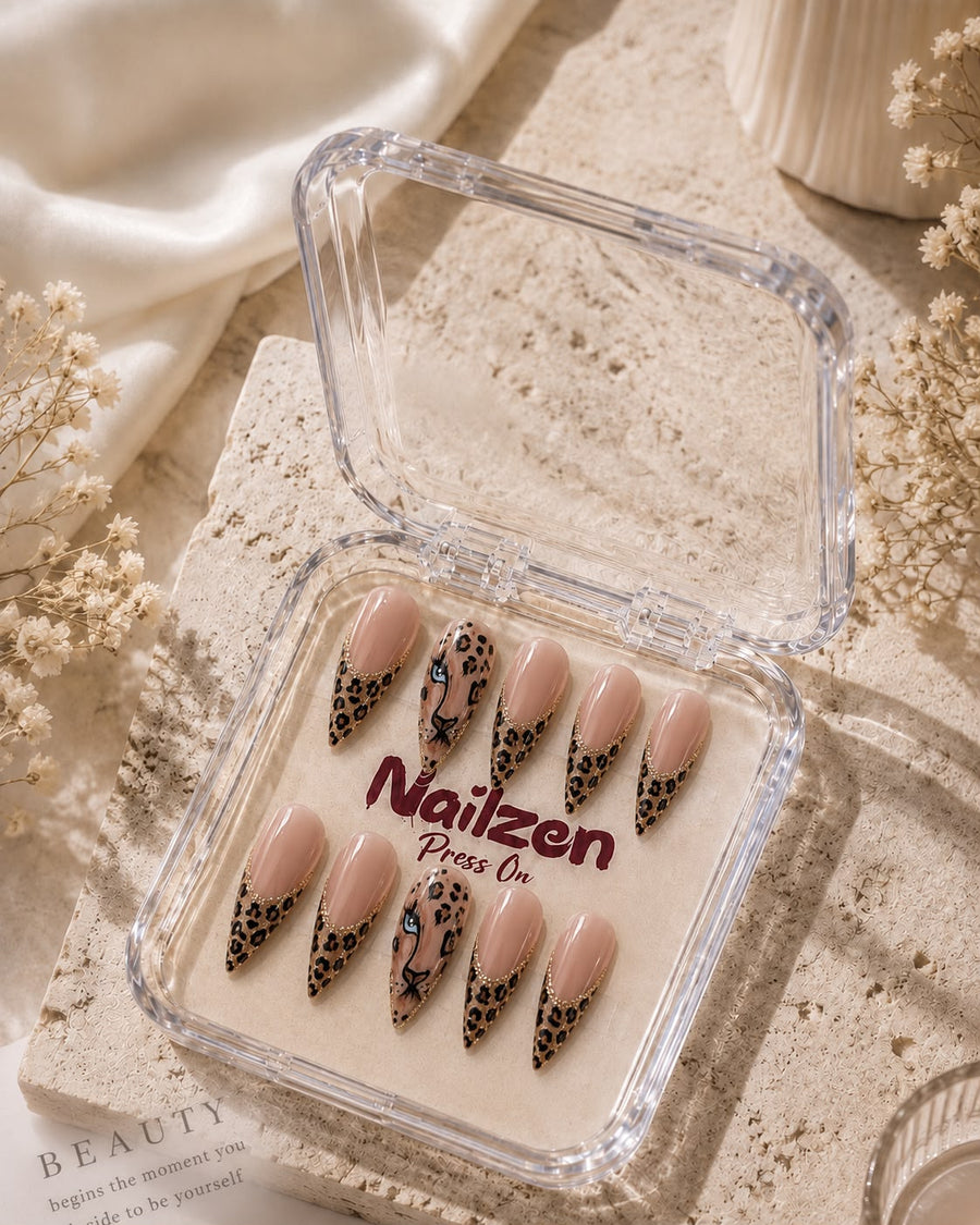 Golden Leopard Print press-on nails - gold foil outlined leopard spots with leopard face accent nail