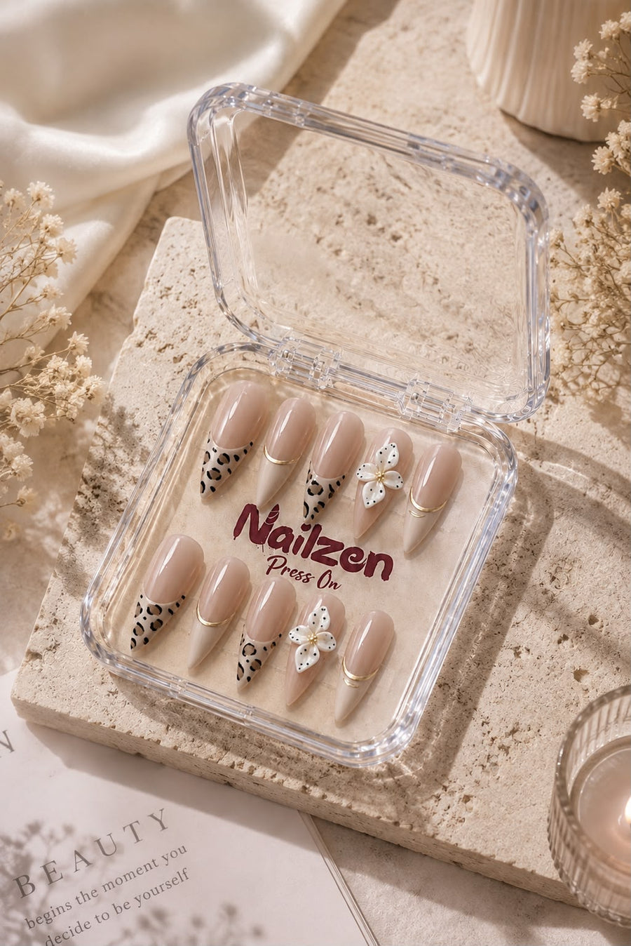 Leopard Bloom French press-on nails - nude leopard print tips with white 3D flower and gold ring accents